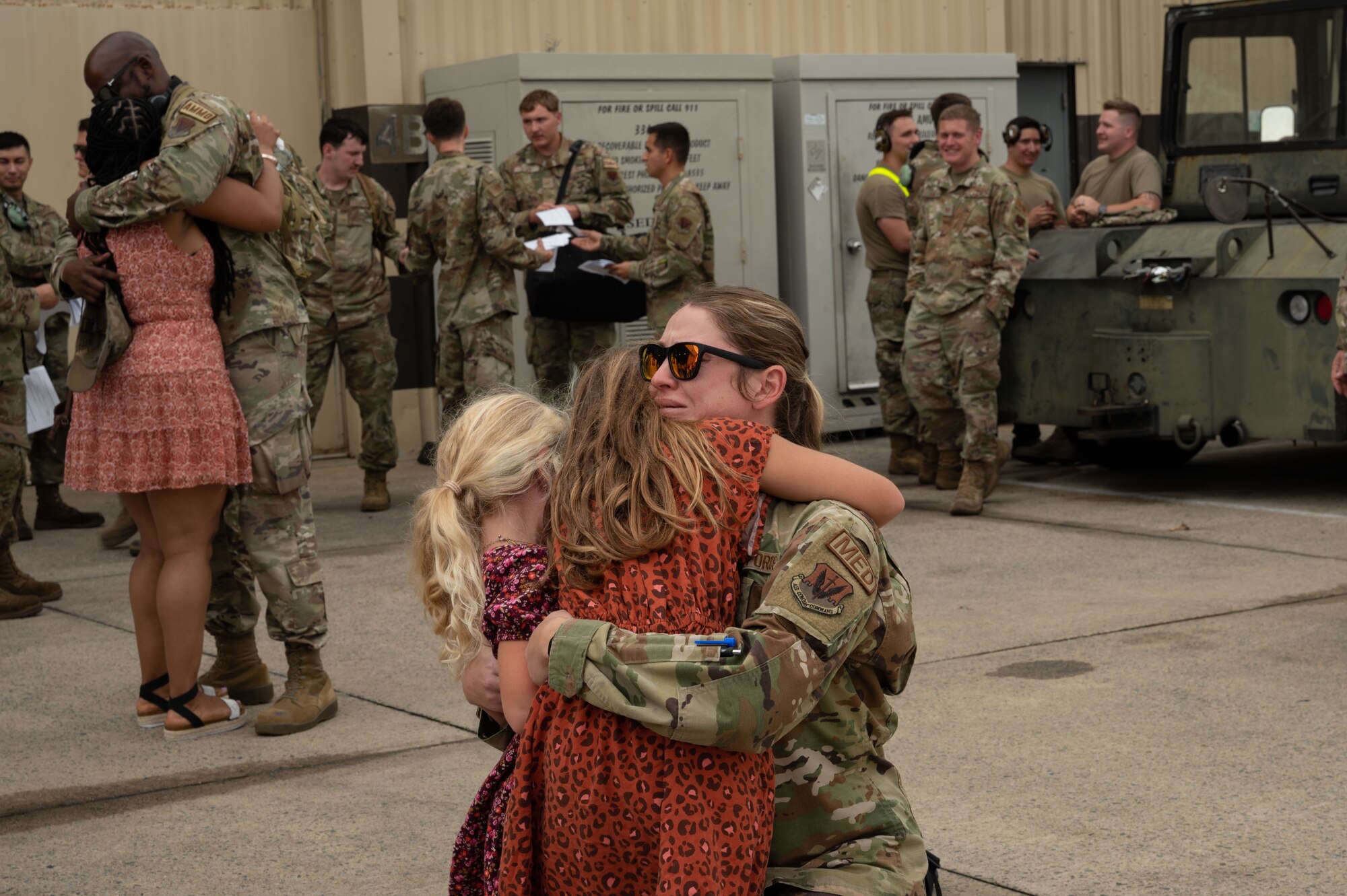An Airman assigned to the 336th Fighter Generation Squadron greets her family during a homecoming ceremony at Seymour Johnson Air Force Base, North Carolina, Oct. 6, 2023. After six months deployed, the Airmen were welcomed back to Seymour Johnson AFB by their families and friends. (U.S. Air Force photo by Airman 1st Class Rebecca Sirimarco-Lang)
