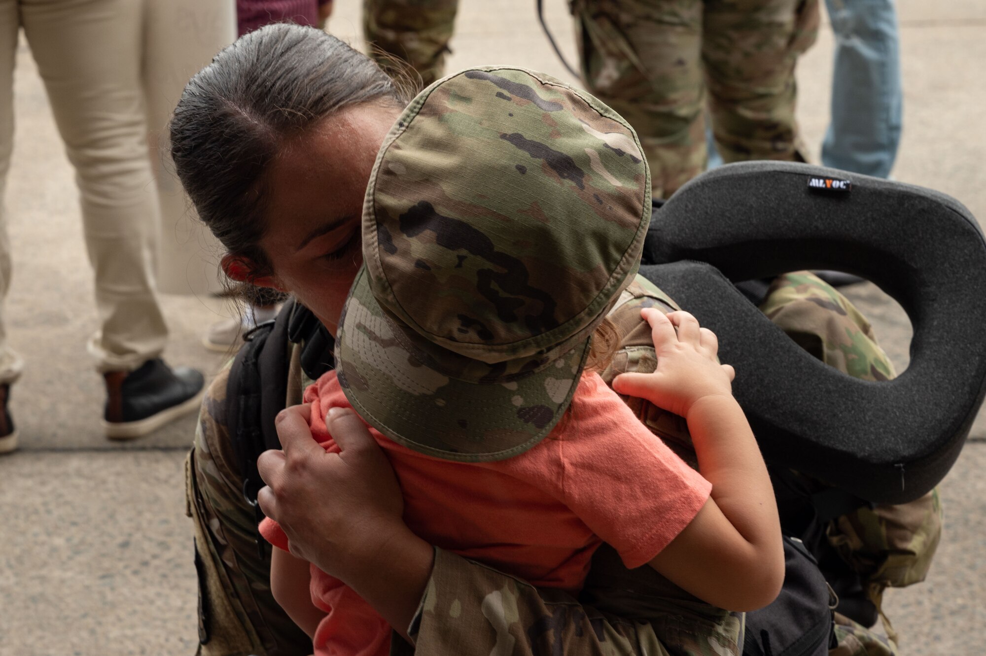 An Airman assigned to the 336th Fighter Generation Squadron greets her family during a homecoming ceremony at Seymour Johnson Air Force Base, North Carolina, Oct. 6, 2023.  After six months deployed, the Airmen were welcomed back to Seymour Johnson AFB by their families and friends. (U.S. Air Force photo by Airman 1st Class Rebecca Sirimarco-Lang)