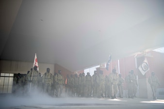 Recruits march through morning mist at Recruit Training Command.