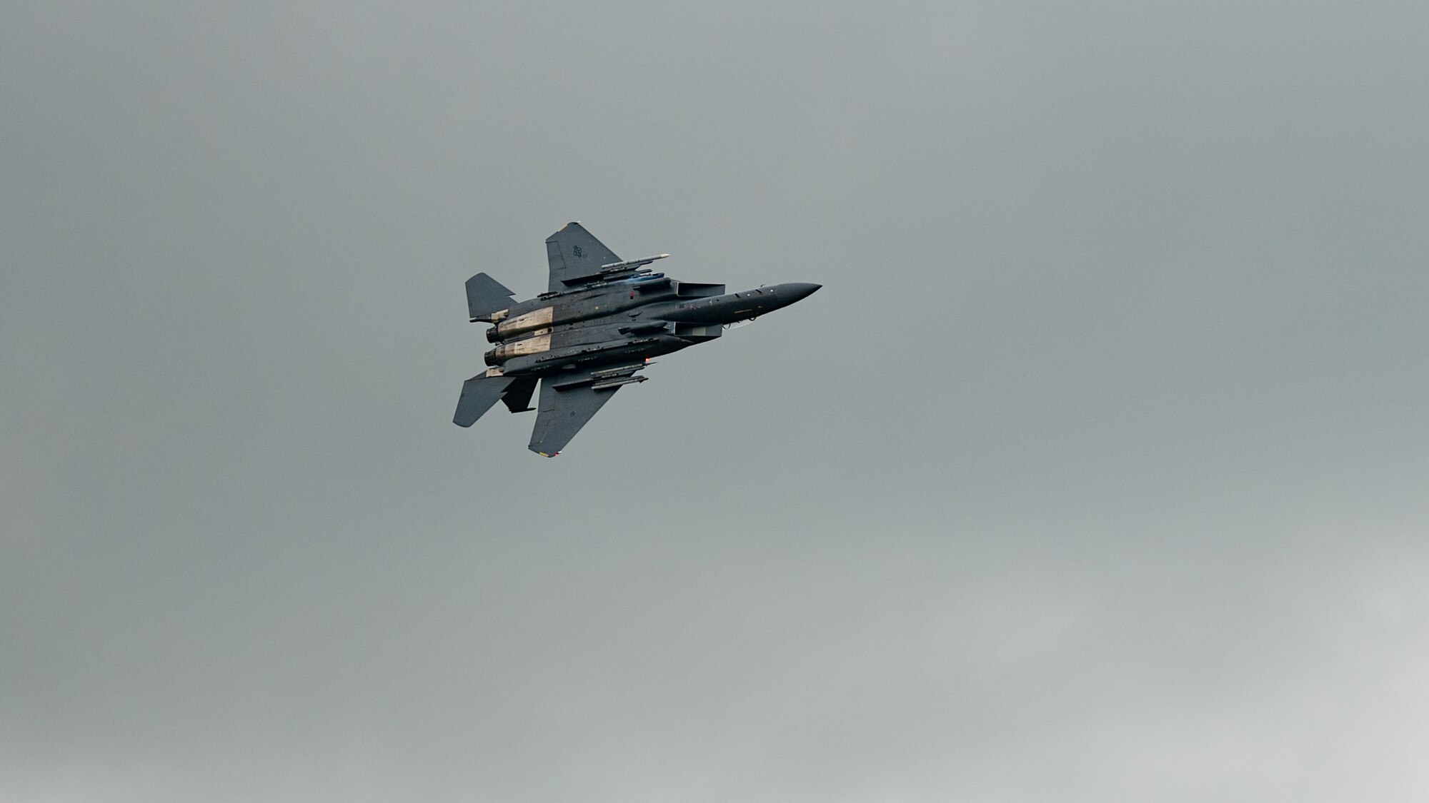 An F-15E Strike Eagle assigned to the 4th Fighter Wing flies over the Appalachian Mountains near Linville, North Carolina, Oct. 16, 2023. The 4th Fighter Wing performs routine flight training to ensure that they are able to project agile combat airpower for the United States and its allies. (U.S. Air Force photo by Airman 1st Class Rebecca Sirimarco-Lang)