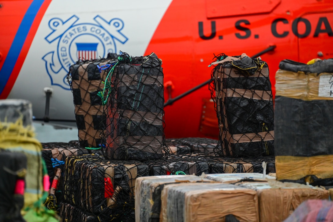 Crewmembers of the Coast Guard Cutter James assist with the offload of more than $445 million in illegal drugs seized by Coast Guard and partner agencies in Port Everglades, Florida, Oct 26, 2023. The offload is a result of suspected drug smuggling interdictions in the Caribbean and Eastern Pacific Ocean. (U.S. Coast Guard photo by Petty Officer 2nd Class Laticia Sims.)