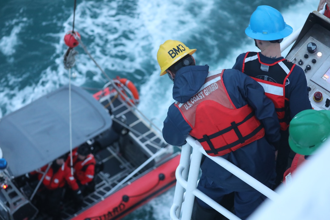 U.S. Coast Guard Cutter Kimball (WMSL 756) crewmembers lower one of the cutter’s 26-foot over-the-horizon small boats using the cutter’s dual-point davit crane while conducting training missions in the Bering Sea, Sept. 16, 2023. The crew provided search-and-rescue coverage and conducted living marine resources (LMR) and counter Illegal Unreported and Unregulated (IUU) Fishing operations during the patrol following their actions responding to the Maui wildfires. U.S. Coast Guard photo.