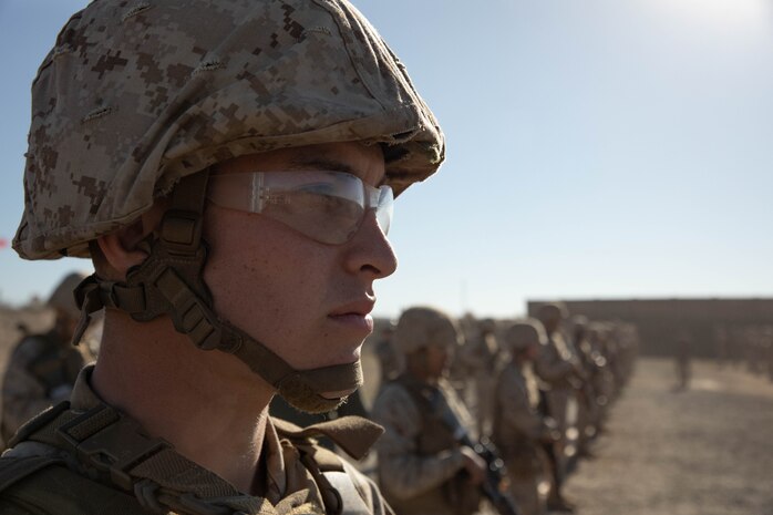 U.S. Marine Corps recruits with Golf Company, 2nd Recruit Training Battalion, await permission to shoot at targets during a table two course of fire at Marine Corps Base Camp Pendleton, California, Oct. 31, 2023. The table two course of fire teaches recruits the fundamentals of safety and marksmanship in combat shooting positions and rifle carries. (U.S. Marine Corps photo by Lance Cpl. Sarah M. Grawcock)