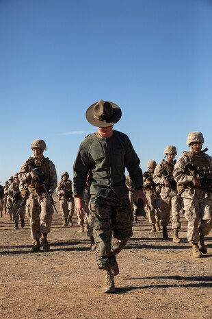 U.S. Marine Corps Primary Marksmanship Instructor, Cpl. Andrea Carbajal, walks down range with recruits from Golf Company, 2nd Recruit Training Battalion during a table two course of fire at Marine Corps Base Camp Pendleton, California, Oct. 31, 2023. The table two course of fire teaches recruits the fundamentals of safety and marksmanship in combat shooting positions and rifle carries. (U.S. Marine Corps photo by Lance Cpl. Sarah M. Grawcock)