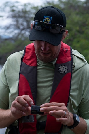 Naval Facilities Engineering Systems Command Environmentalist hunt for invasive coral off the waters of JBPHH.