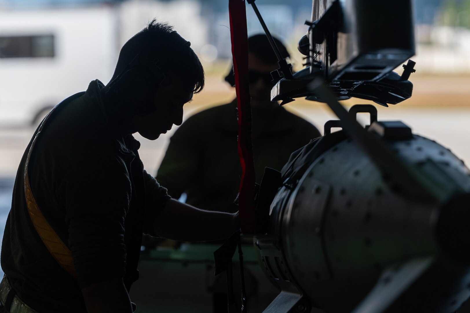 Staff Sgt. Joshua Denice positions a munition on a U.S. Air Force F-16 Fighting Falcon during Vigilant Defense 24.