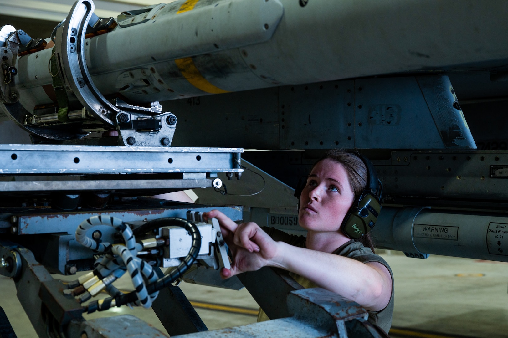 Senior Airmen Kelly McKamy loads munitions onto a U.S. Air Force F-16 Fighting Falcon during Vigilant Defense 24.