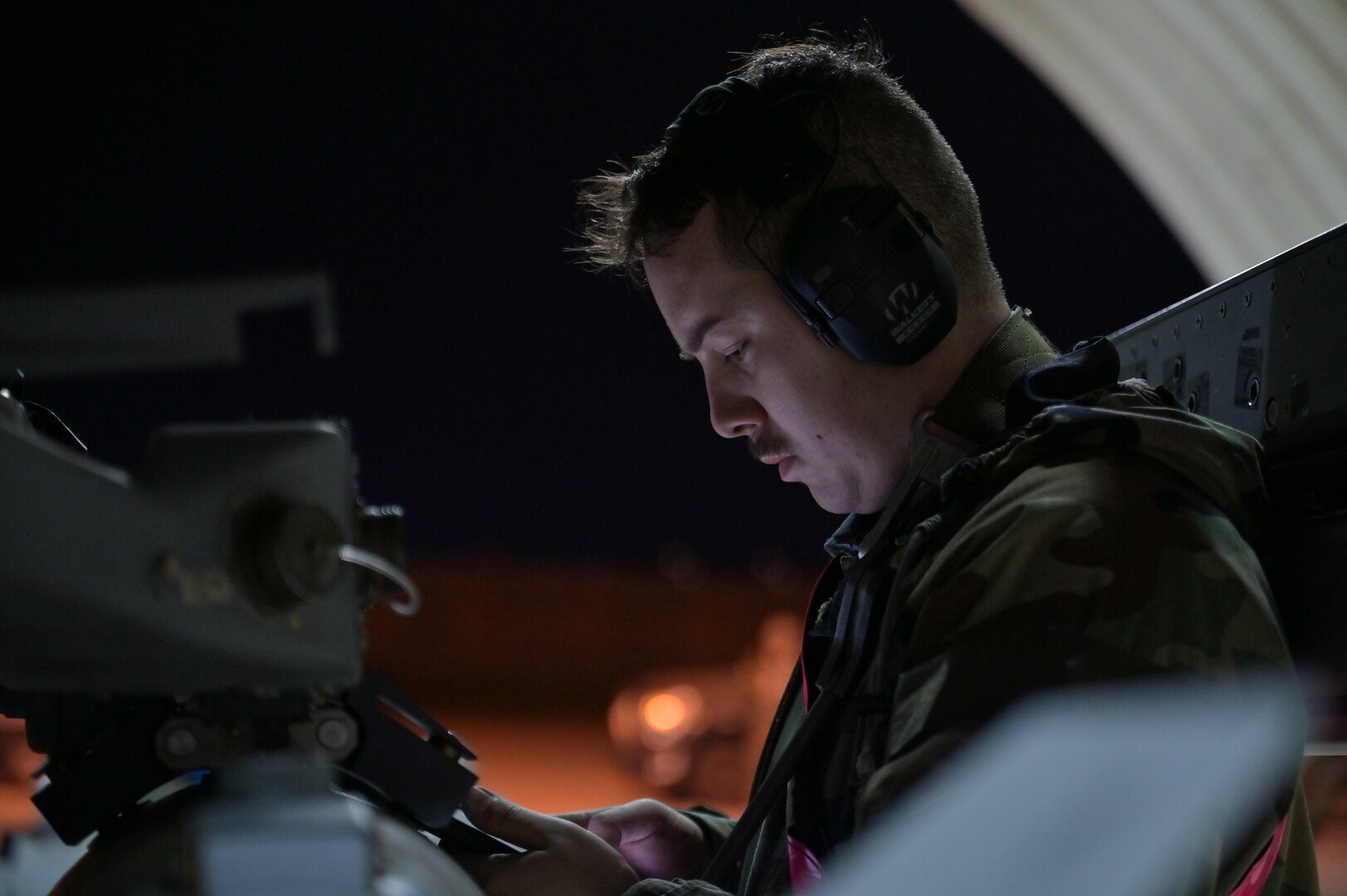 Staff Sgt. Ashton Alamo reads the technical order before securing a munition to a U.S. Air Force F-16 Fighting Falcon during Vigilant Defense 24.