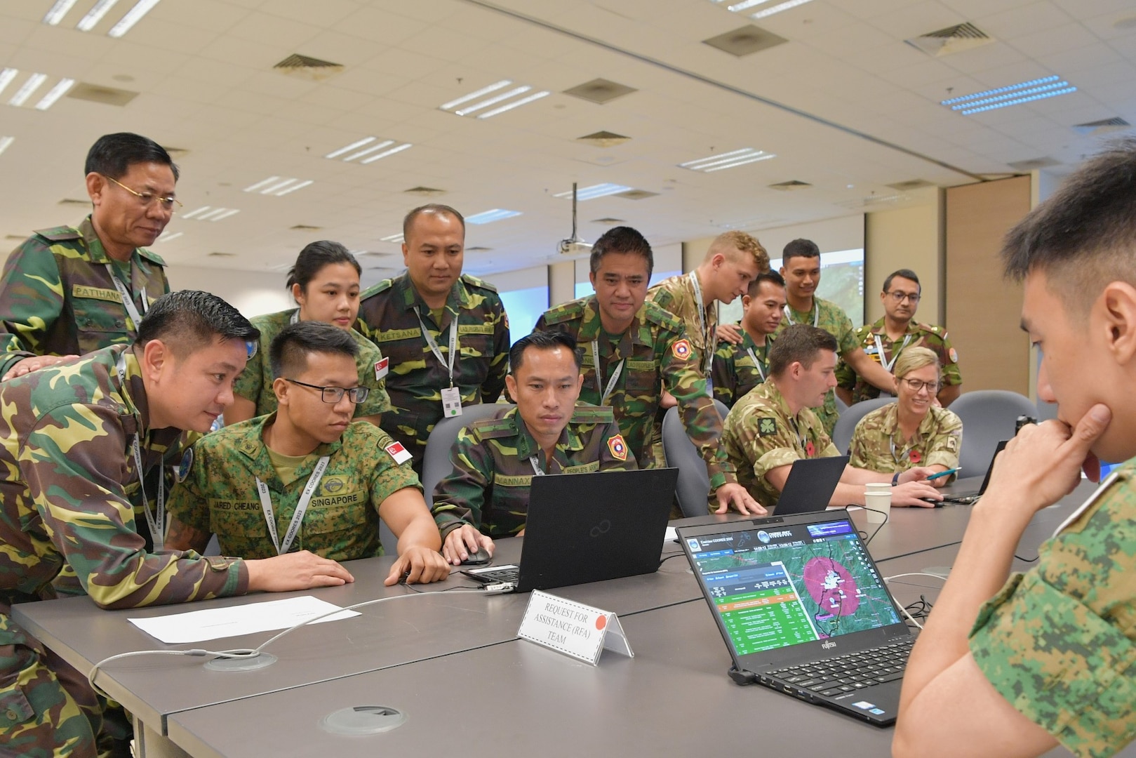 Military participants were actively engaged in a training session on the use of the Regional Humanitarian Assistance and Disaster Relief (HADR) Coordination Centre's (RHCC) OPERA Computer Information System (CIS).