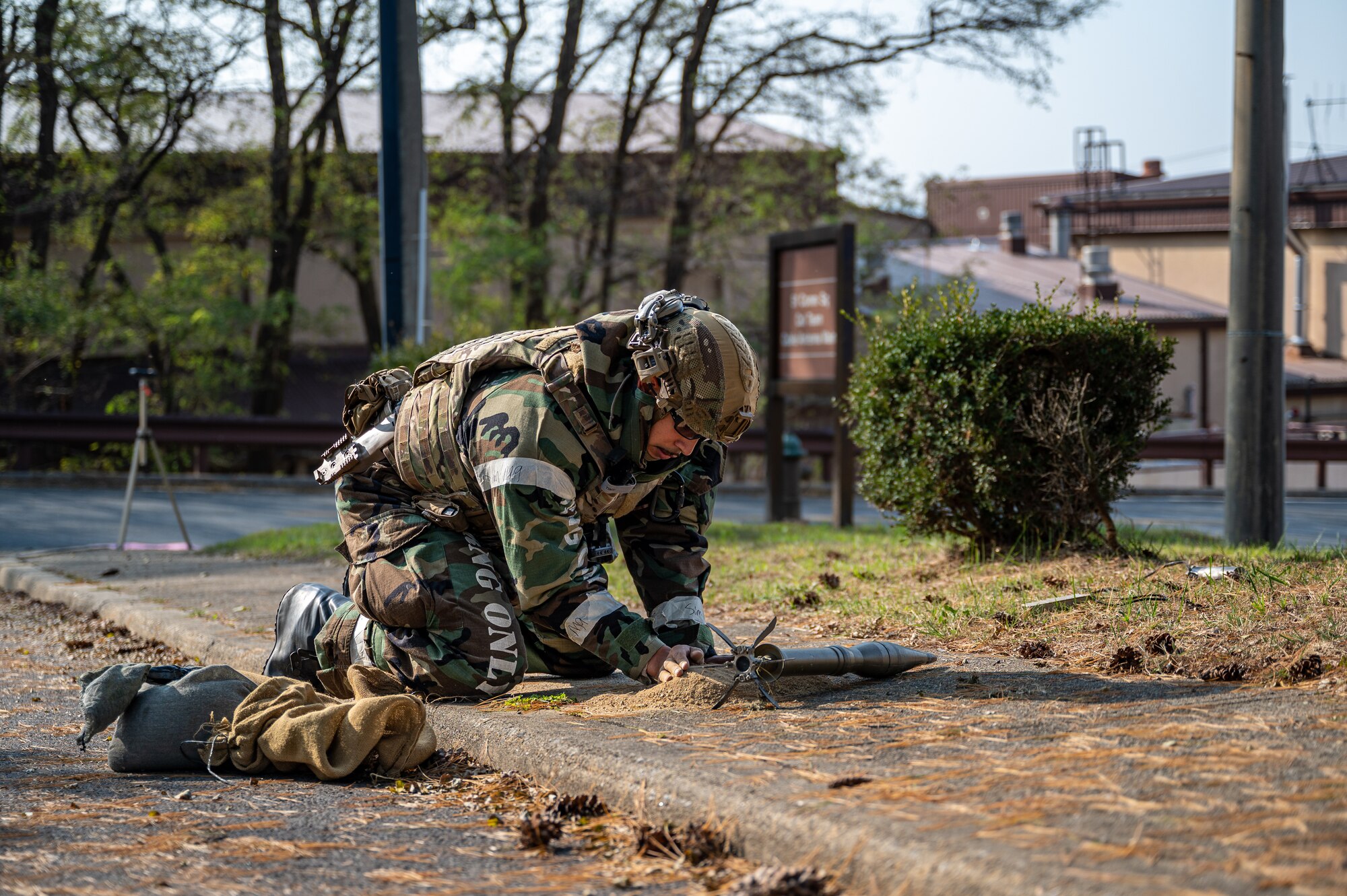 U.S. Air Force Senior Airman Noah Yates, 51st Civil Engineer Squadron Explosive Ordnance Disposal technician, prepares to dispose of a simulated unexploded ordnance during Vigilant Defense 24 at Osan Air Base, Republic of Korea, Oct. 31, 2023. VD24 is a routine training event that tests the military capabilities across the peninsula, allowing combined and joint training at both the operational and tactical levels. (U.S. Air Force photo by Staff Sgt. Thomas Sjoberg)