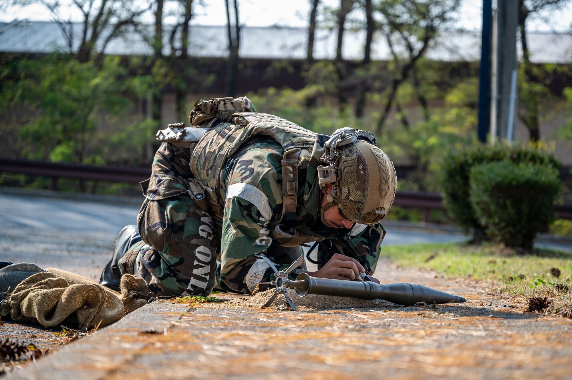 U.S. Air Force Senior Airman Noah Yates, 51st Civil Engineer Squadron Explosive Ordnance Disposal technician, prepares to dispose of a simulated unexploded ordnance during Vigilant Defense 24 at Osan Air Base, Republic of Korea, Oct. 31, 2023. VD24 is a routine training event that tests the military capabilities across the peninsula, allowing combined and joint training at both the operational and tactical levels. (U.S. Air Force photo by Staff Sgt. Thomas Sjoberg)