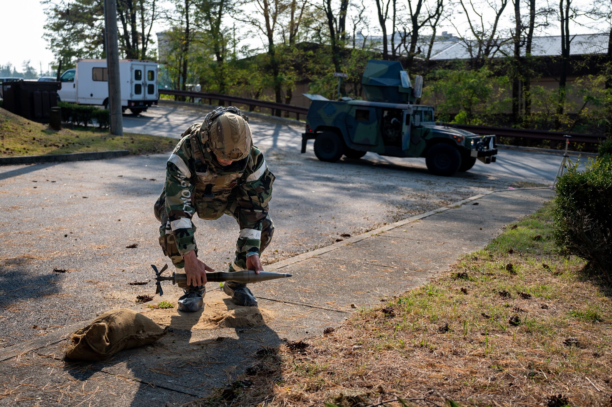 U.S. Air Force Senior Airman Noah Yates, 51st Civil Engineer Squadron Explosive Ordnance Disposal technician, removes a simulated unexploded ordnance after responding to a UXO scenario during Vigilant Defense 24 at Osan Air Base, Republic of Korea, Oct. 31, 2023. VD24 is a routine training event that tests the military capabilities across the peninsula, allowing combined and joint training at both the operational and tactical levels. (U.S. Air Force photo by Staff Sgt. Thomas Sjoberg)