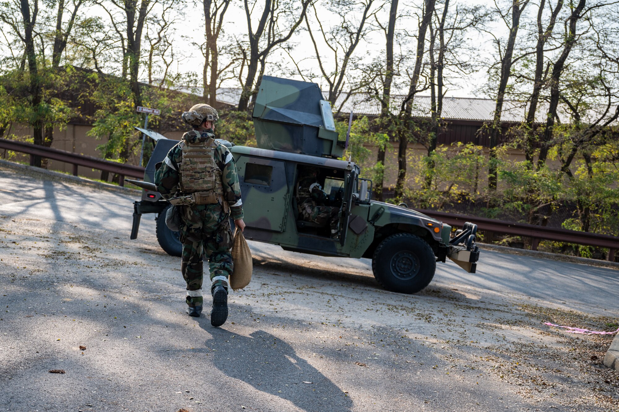 U.S. Air Force Senior Airman Noah Yates, 51st Civil Engineer Squadron Explosive Ordnance Disposal technician, leaves the scene after responding to a simulated unexploded ordnance call during Vigilant Defense 24 at Osan Air Base, Republic of Korea, Oct. 31, 2023. VD24 is a routine training event that tests the military capabilities across the peninsula, allowing combined and joint training at both the operational and tactical levels. (U.S. Air Force photo by Staff Sgt. Thomas Sjoberg)