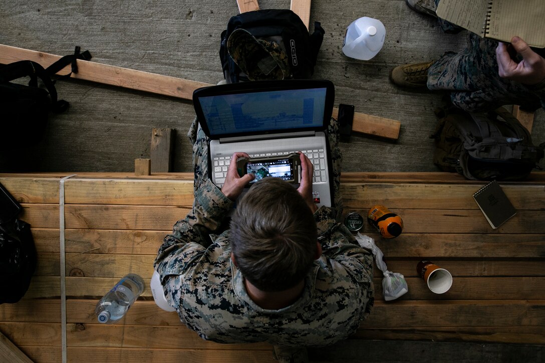 U.S. Marine Corps Cpl. Taylor Jenkins, a combat engineer with the Littoral Engineer Reconnaissance Team, 9th Engineer Support Battalion, 3d Marine Logistics Group, utilizes the Android Tactical Assault System to input reconnaissance findings into an after action report during a littoral mobility and detection exercise on Camp Pendleton, California, Nov. 18, 2021. The ATAK is a tool that allows Marines to rapidly report critical geospatial information to support intelligence requirements for a given objective. During this exercise, 7th and 9th ESB are refining their skills with emerging Marine Corps technologies in order to facilitate follow-on forces’ littoral mobility from shallow water to the objective. (U.S. Marine Corps photo by Sgt. Hailey D. Clay)