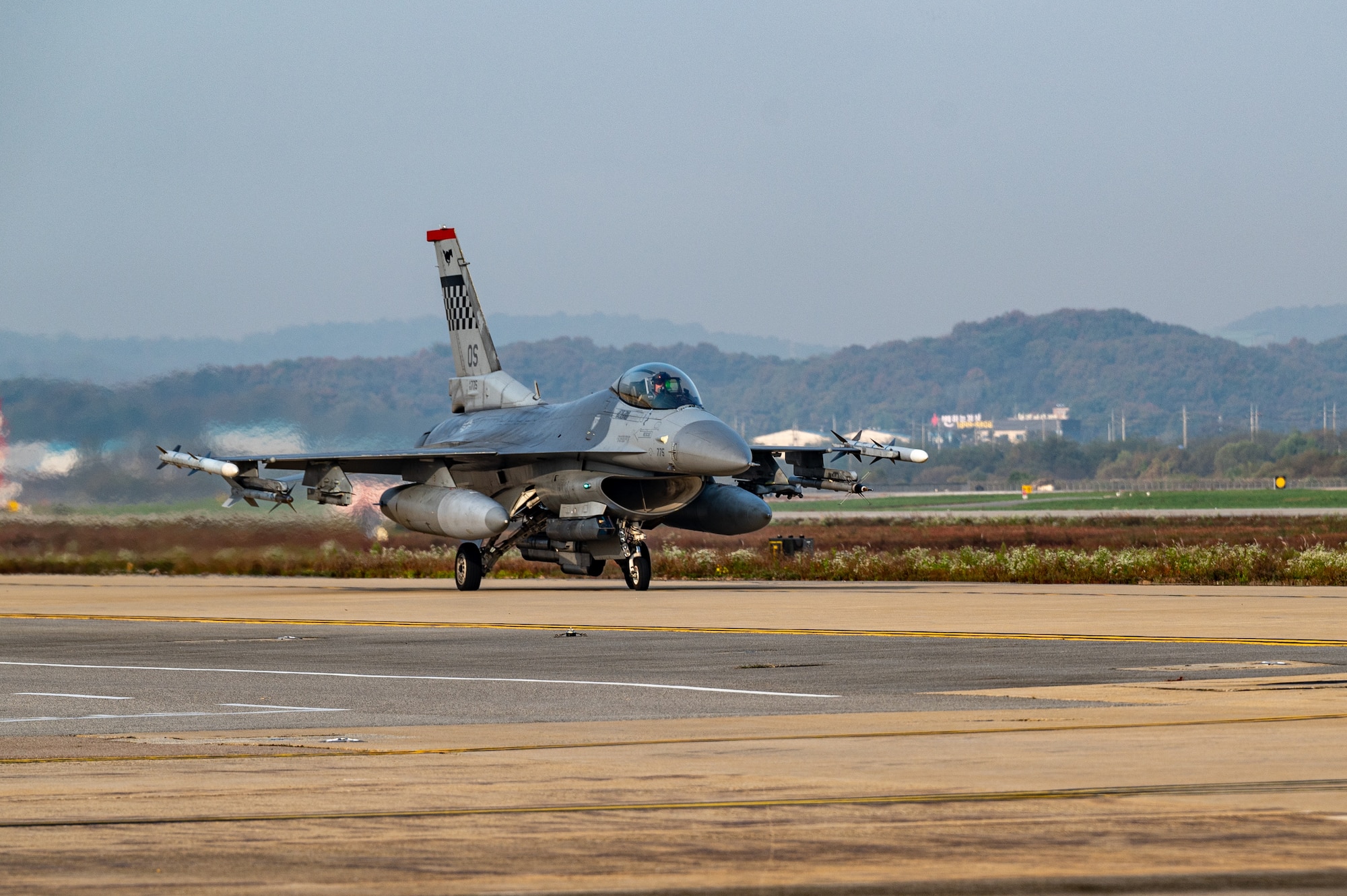 231030-F-QO603-1240
A U.S. Air Force F-16 Fighting Falcon taxis down an alternate landing strip during Vigilant Defense 24 at Osan Air Base, Republic of Korea, Oct. 30, 2023. The reallocation of flightline space allows pilots to continue flying operations despite damage to the main runway. VD24 is a routine training event that tests the military capabilities across the peninsula, allowing combined and joint training at both the operational and tactical levels. Training is conducted throughout the year to generate combat airpower at a moment’s notice, affirming the commitment to the ROK remains ironclad and ensures regional stability throughout the Indo-Pacific. (U.S. Air Force photo by Staff Sgt. Thomas Sjoberg)