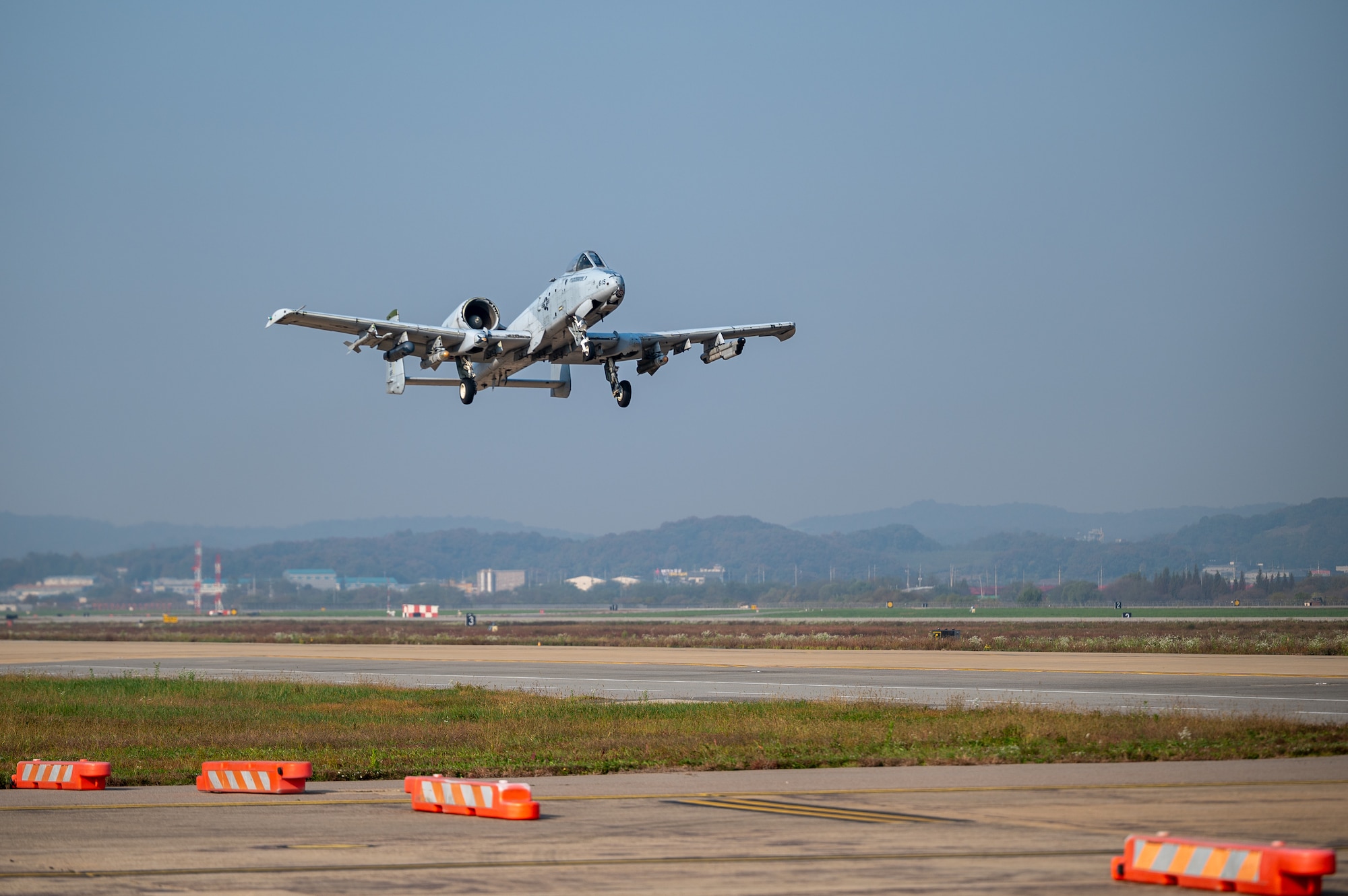 A U.S. Air Force A-10C Thunderbolt II takes off using an alternate landing strip during Vigilant Defense 24 at Osan Air Base, Republic of Korea, Oct. 30, 2023. In contingency environments, the ALS is activated when the main runway sustains heavy damage, which allows pilots to maintain readiness and continue flying operations. VD24 is a routine training event that tests the military capabilities across the peninsula, allowing combined and joint training at both the operational and tactical levels. Training is conducted throughout the year to generate combat airpower at a moment’s notice, affirming the commitment to the ROK remains ironclad and ensures regional stability throughout the Indo-Pacific. (U.S. Air Force photo by Staff Sgt. Thomas Sjoberg)