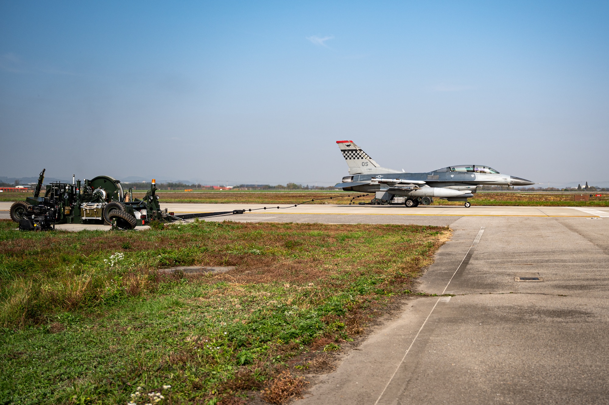 A U.S. Air Force F-16 Fighting Falcon stops on an alternate landing strip using a Mobile Aircraft Arresting System during Vigilant Defense 24 at Osan Air Base, Republic of Korea, Oct. 30, 2023. In contingency environments, the ALS is activated when the main runway sustains heavy damage, which allows pilots to maintain readiness and continue flying operations. VD24 is a routine training event that tests the military capabilities across the peninsula, allowing combined and joint training at both the operational and tactical levels. Training is conducted throughout the year to generate combat airpower at a moment’s notice, affirming the commitment to the ROK remains ironclad and ensures regional stability throughout the Indo-Pacific. (U.S. Air Force photo by Staff Sgt. Thomas Sjoberg)
