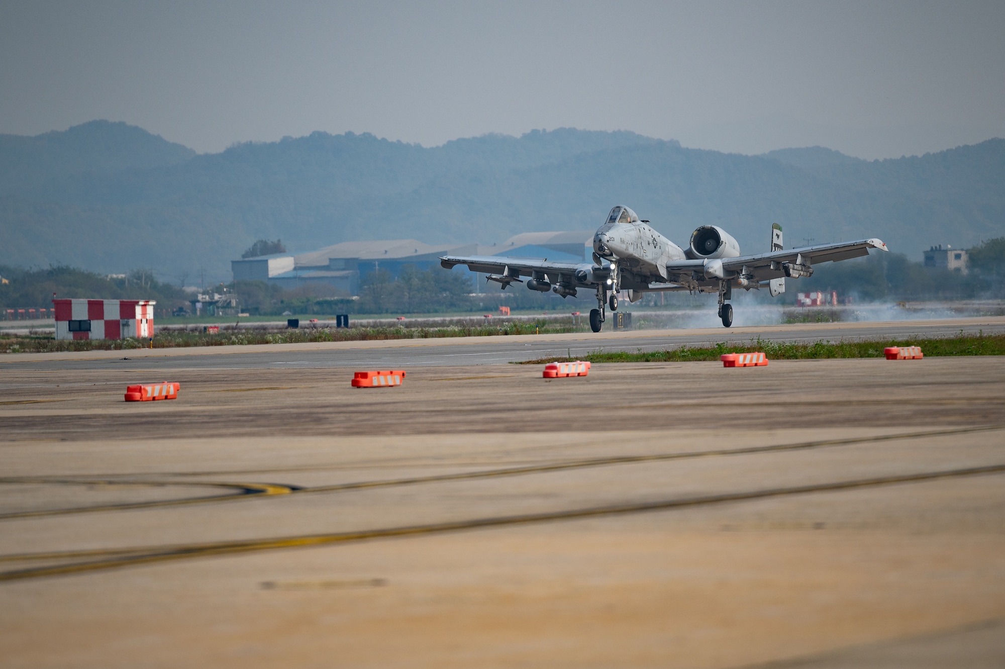 A U.S. Air Force A-10C Thunderbolt II lands on an alternate landing strip during Vigilant Defense 24 at Osan Air Base, Republic of Korea, Oct. 30, 2023. The reallocation of flightline space allows pilots to continue flying operations despite damage to the main runway. VD24 is a routine training event that tests the military capabilities across the peninsula, allowing combined and joint training at both the operational and tactical levels. (U.S. Air Force photo by Staff Sgt. Thomas Sjoberg)