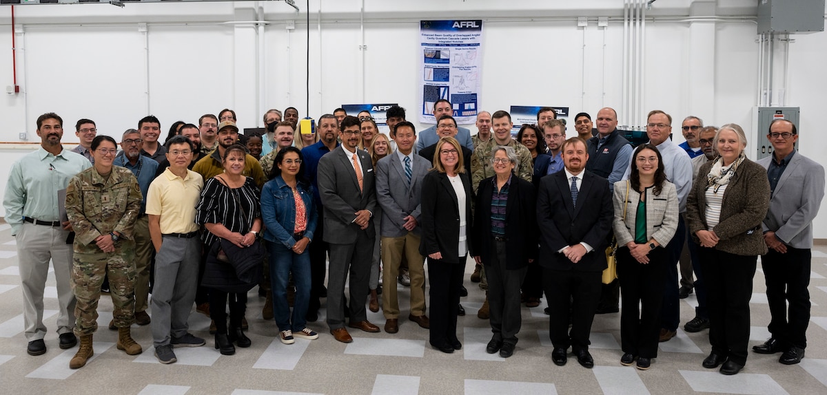 Members and supporters of the Air Force Laboratory directed energy directorate pose for a group photo after the ribbon cutting of the new Semiconductor Laser Indoor Propagation Range on Kirtland Air Force Base, N.M., Oct. 17, 2023. The range will serve to further aid AFRL in the research and development of propagation studies to fill in critical technology gaps.  (U.S. Air Force photo / Airman 1st Class Ruben Garibay)