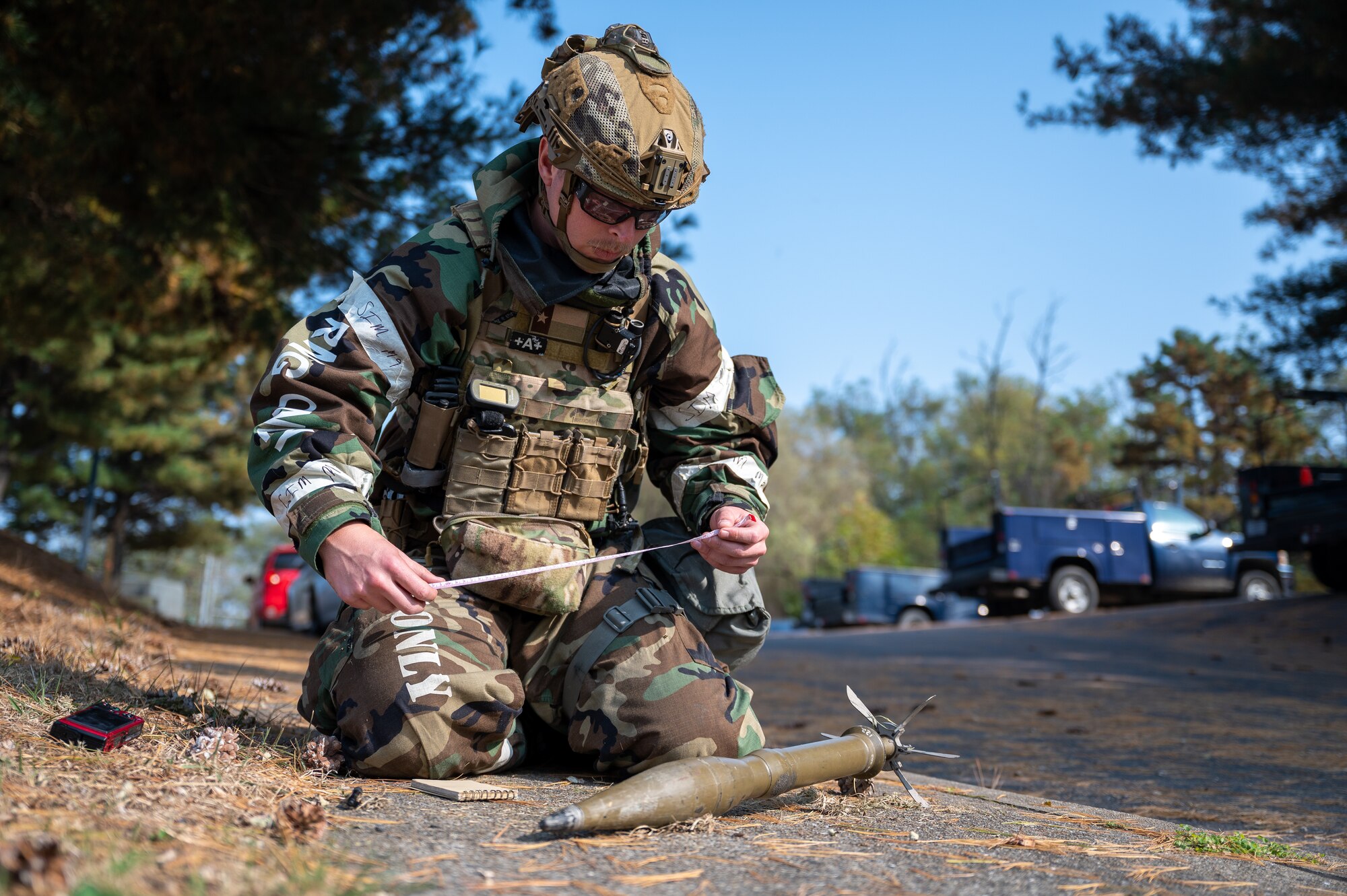 U.S. Air Force Staff Sgt. Carson Hudson, 51st Civil Engineer Squadron Explosive Ordnance Disposal team leader, measures a simulated unexploded ordnance during Vigilant Defense 24 at Osan Air Base, Republic of Korea, Oct. 31, 2023. VD24 is a routine training event that tests the military capabilities across the peninsula, allowing combined and joint training at both the operational and tactical levels. The 51st Fighter Wing guards the freedom of 51 million people by deterring aggression, defending the ROK, and defeating any attack against the ironclad ROK-US Alliance. (U.S. Air Force photo by Staff Sgt. Thomas Sjoberg)