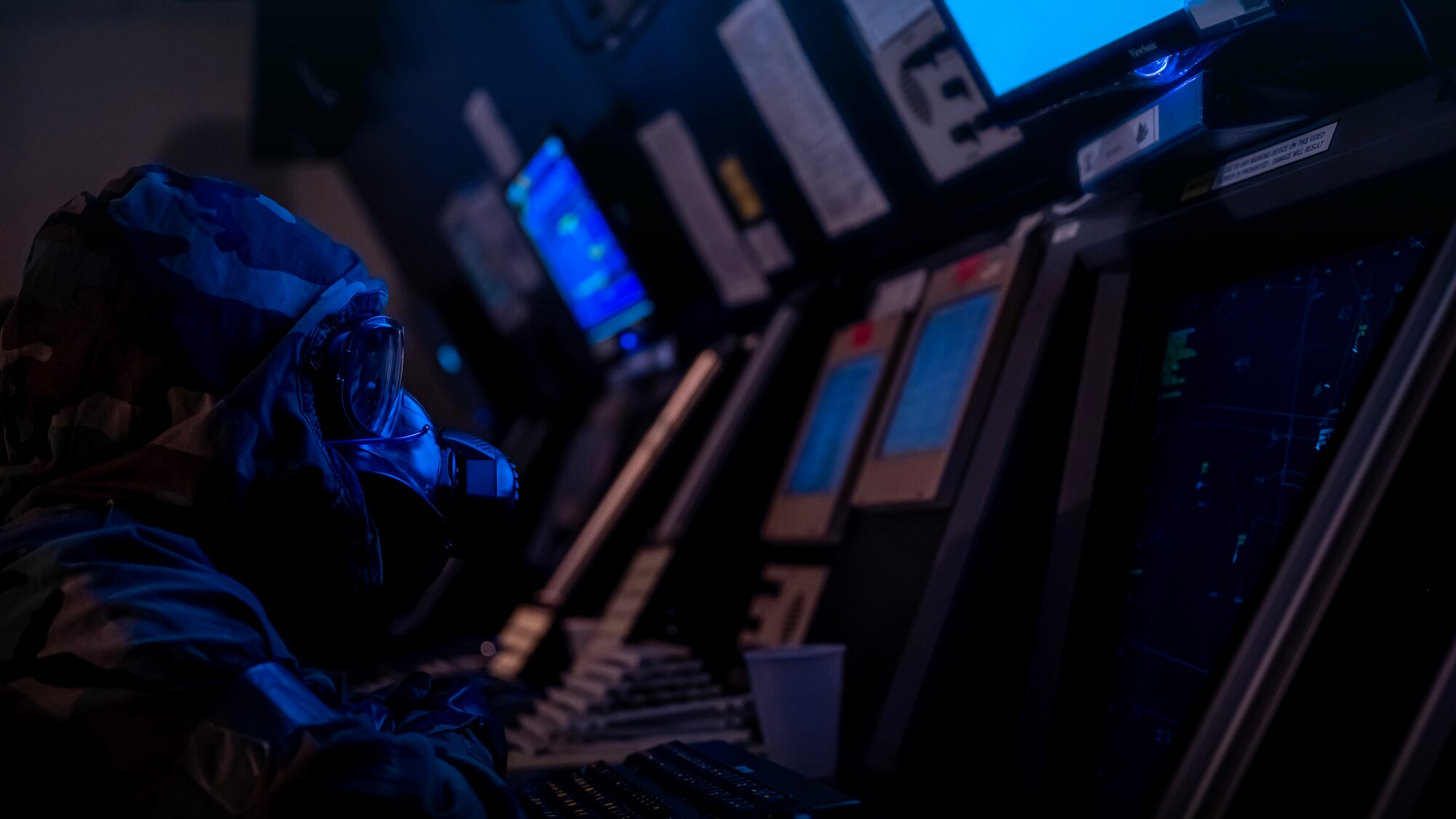 Staff Sgt. Valerie Ashlock controls the airfield while in MOPP gear during exercise Vigilant Defense 24.