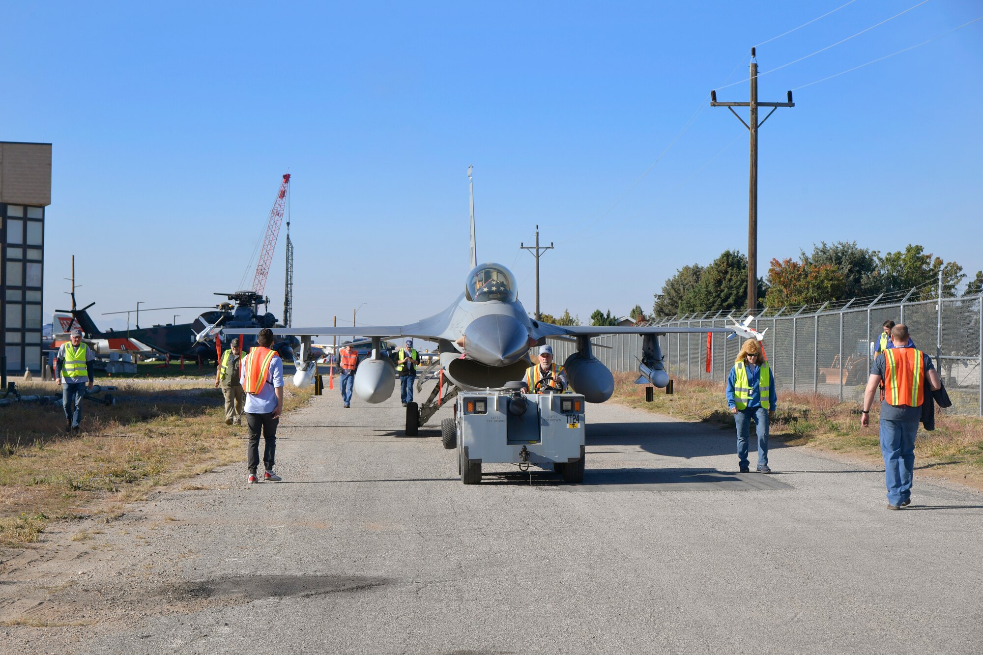 Crews relocate an F-16 Fighting Falcon static display at the Hill Aerospace Museum Oct. 24, 2023, at Hill Air Force Base, Utah. Last month, a significant portion of the museum’s modern generation aircraft were moved into the new L.S. Skaggs Gallery by museum staff and volunteers from organizations outside the museum. (U.S. Air Force photo by Todd Cromar)