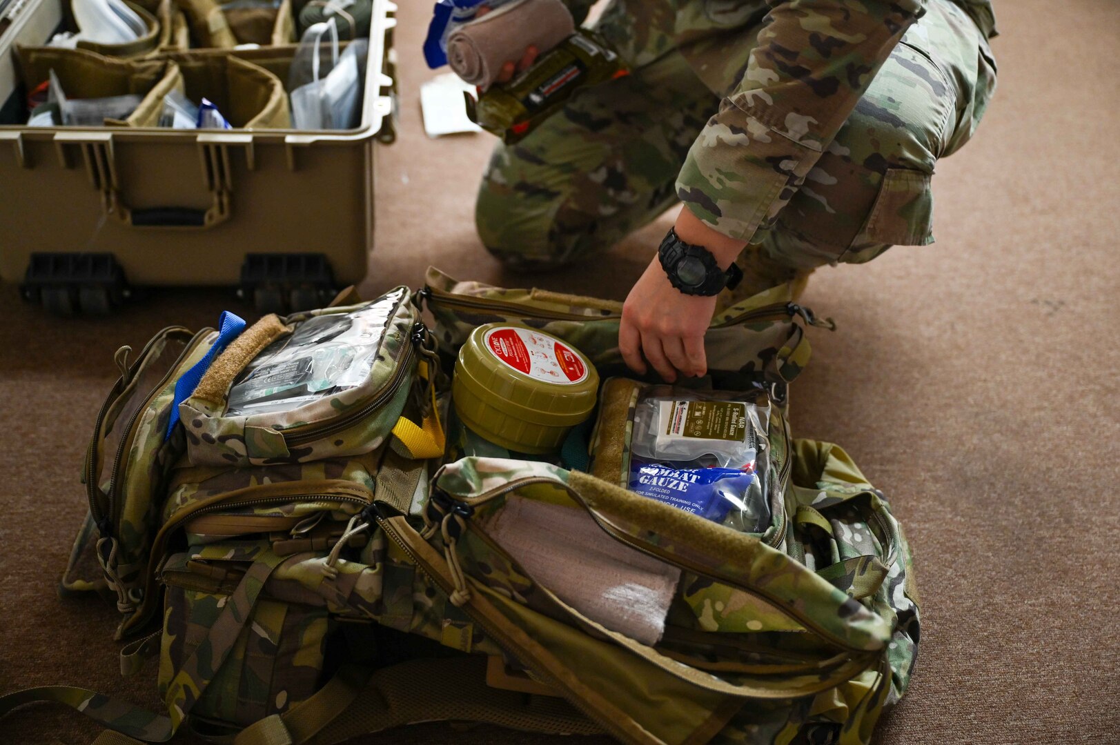 U.S. Air Force Staff Sgt. Rebekah Clifford, 82nd Medical Group independent duty medical technician, packs her bag in preparation for the Caduceus Spear exercise at Clinton Sherman Airfield Park, Oklahoma, Oct. 26, 2023. The scenario for the exercise was meant to simulate how to give life-saving care to several blast victims before air evacuation arrives. (U.S. Air Force photo by Airman 1st Class Kari Degraffenreed)