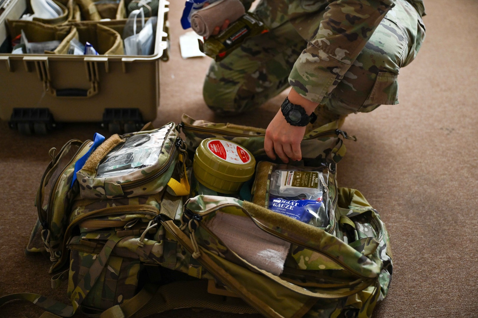 U.S. Air Force Staff Sgt. Rebekah Clifford, 82nd Medical Group independent duty medical technician, packs her bag in preparation for the Caduceus Spear exercise at Clinton Sherman Airfield Park, Oklahoma, Oct. 26, 2023. The scenario for the exercise was meant to simulate how to give life-saving care to several blast victims before air evacuation arrives. (U.S. Air Force photo by Airman 1st Class Kari Degraffenreed)