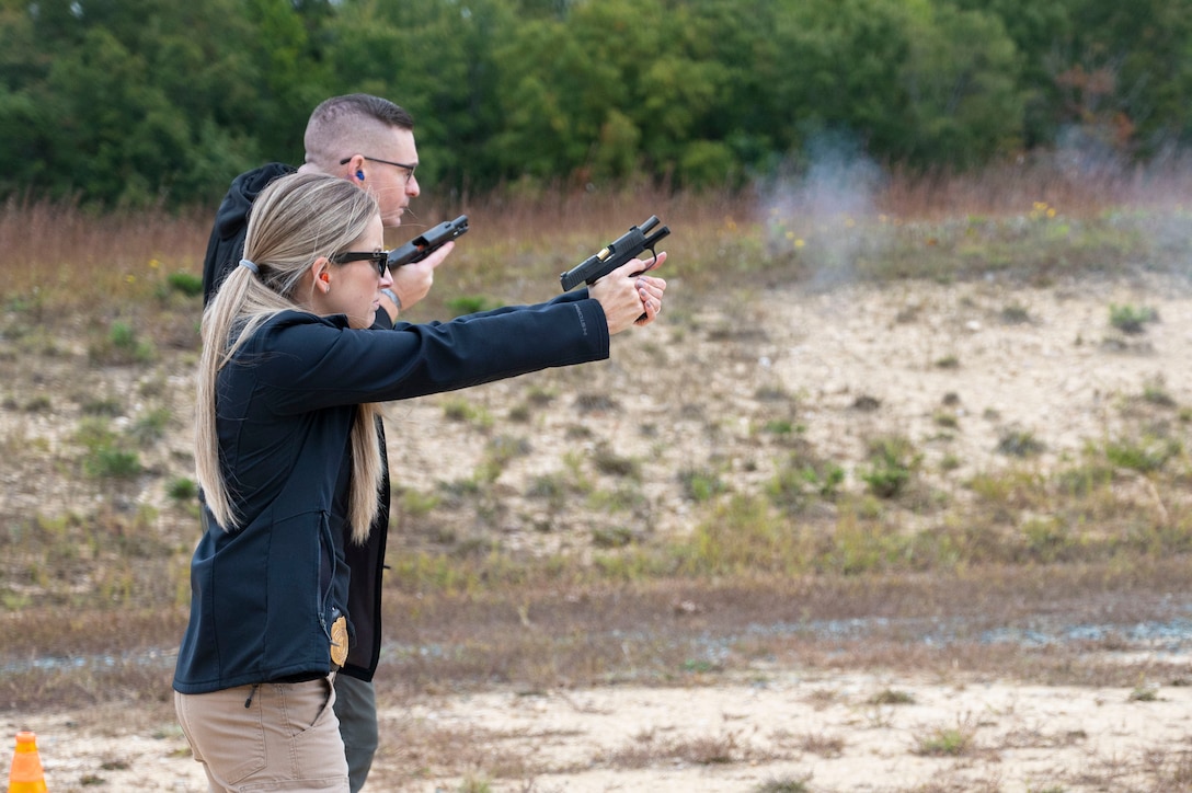 An Office of Special Investigations special agent fires her weapon on the range at Marine Corps Base Quantico, Va. Oct. 17, 2023. Naval Criminal Investigative Service launched this range in 2020 after working to fund and rehabilitate the range, just down the road from the Russell-Knox Building, headquarters for both agencies. (U.S. Air Force photo by Tech, Sgt. Joshua King)