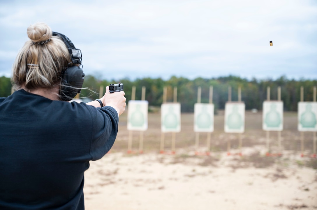 An Office of Special Investigations special agent fires her weapon on the range at Marine Corps Base Quantico, Va. Oct. 17, 2023. Naval Criminal Investigative Service launched this range in 2020 after working to fund and rehabilitate the range, just down the road from the Russell-Knox Building, headquarters for both agencies. (U.S. Air Force photo by Tech, Sgt. Joshua King)