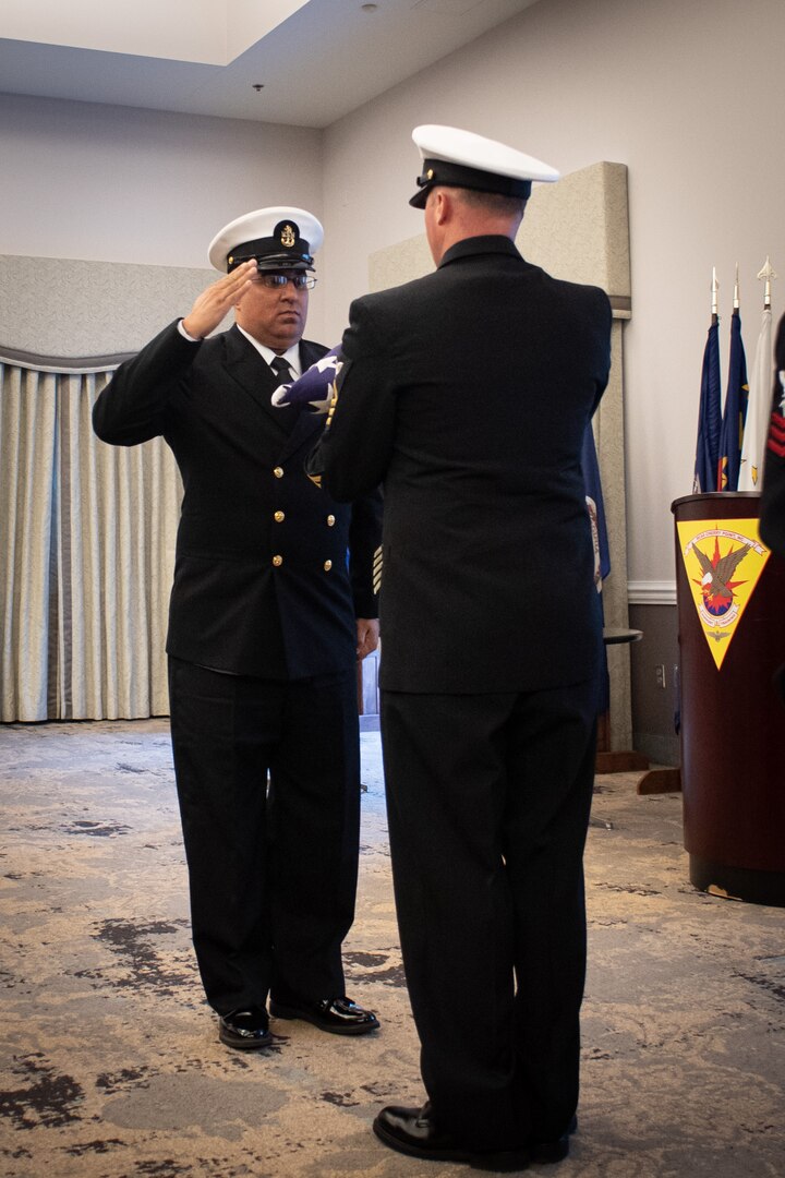 Chief Hospital Corpsman Felix Colon (Fleet Marine Force / Enlisted Expeditionary Warfare Specialist) salutes the flag of the United States of America during a ceremony held Thursday, November 2, 2023 aboard Marine Corps Air Station Cherry Point.  Colon retired after 23 years of service in the United States Navy, ending his service as the Senior Enlisted Leader for the Directorate of Clinical Support Services and Directorate of Medical Services at Naval Health Clinic Cherry Point.