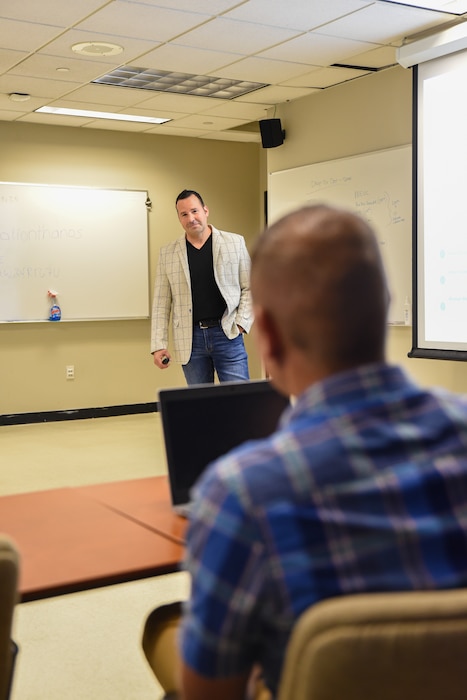 Utah Air National Guard members sit in a classroom and participate in leadership training.