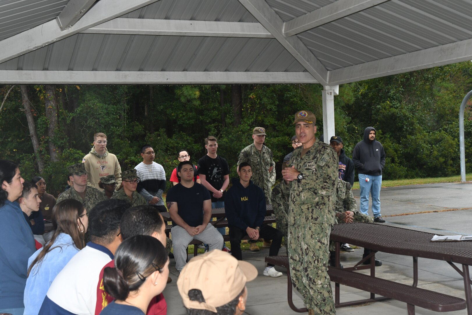 NMCCL Commanding Officer Capt. Kevin Brown unveils the new kitchenettes for Sailors living at the bachelor enlisted quarters after a weekly field day on October 19, 2023.
