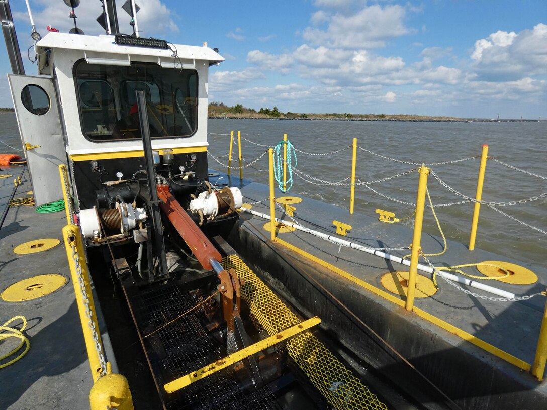 USACE’s contractor (DredgIT of Houston, TX) conducts dredging operations in the federal channel of the Lewes & Rehoboth Canal in November 2023. The federal channel hasn’t been dredged in a number of years. The waterway is used by commercial and recreational fishing charter boats, the U.S. Coast Guard, and the Delaware Bay and River Cooperative (DBRC), whose mission is oil spill emergency response/cleanup for events occurring in the Delaware River and Bay (Photo by Ed Voigt).