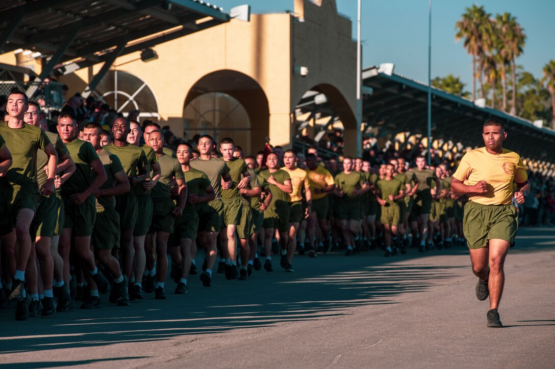 U.S. Marines with Hotel Company, 2nd Recruit Training Battalion, run in formation during the motivational run at Marine Corps Recruit Depot San Diego, Nov. 2, 2023. The motivational run signifies the last physical fitness event conducted in recruit training. (U.S. Marine Corps photo by Sgt. Sydney Smith)