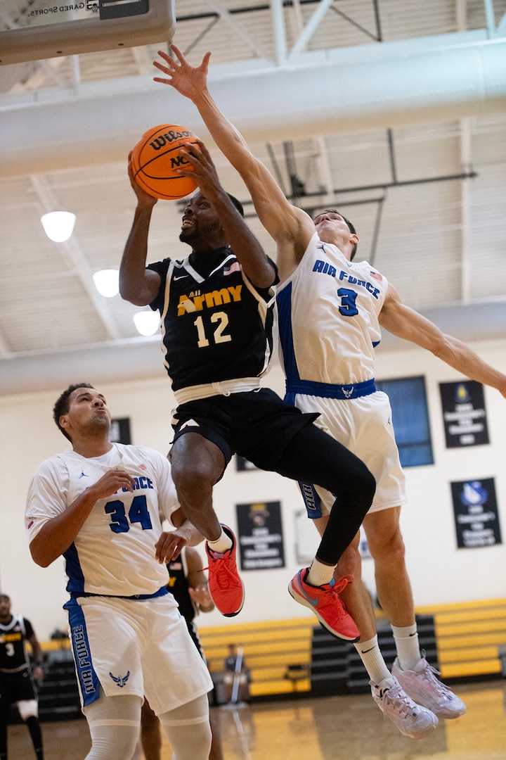 Army Staff Sgt. Donald Tention drives to the net during the 2023 Armed Forces Men’s and Women’s Basketball Championships at Fort Moore, Ga. Nov. 2, 2023.  (DoD photo by EJ Hersom)