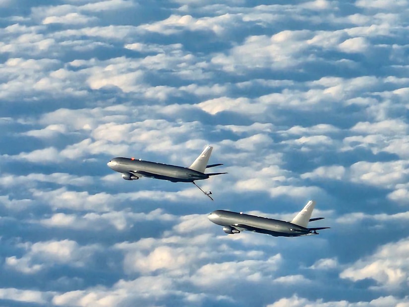 A KC-46A Pegasus tanker assigned to Joint Base McGuire-Dix-Lakehurst, N.J., practices refueling operations on another KC-46A en route to Travis Air Force Base, Calif., Oct. 21, 2023. This joint air interoperability exercise is the first-ever certification event for the KC-46 tankers assigned to Joint Base McGuire-Dix-Lakehurst, N.J. (U.S. Air Force photo by Airman 1st Class Simonne Barker)