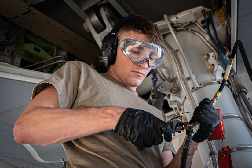 U.S. Air Force Senior Airman Lane Hilderbrand, 605th Aircraft Maintenance Squadron flying crew chief, checks the main landing gear pressure for the KC-46A Pegasus during the Neptune Series at Travis Air Force Base, Calif., Oct. 24, 2023. This joint air interoperability exercise is the first-ever certification event for the KC-46A Pegasus tankers assigned to Joint Base McGuire-Dix-Lakehurst, N.J. (U.S. Air Force photo by Airman 1st Class Simonne Barker)