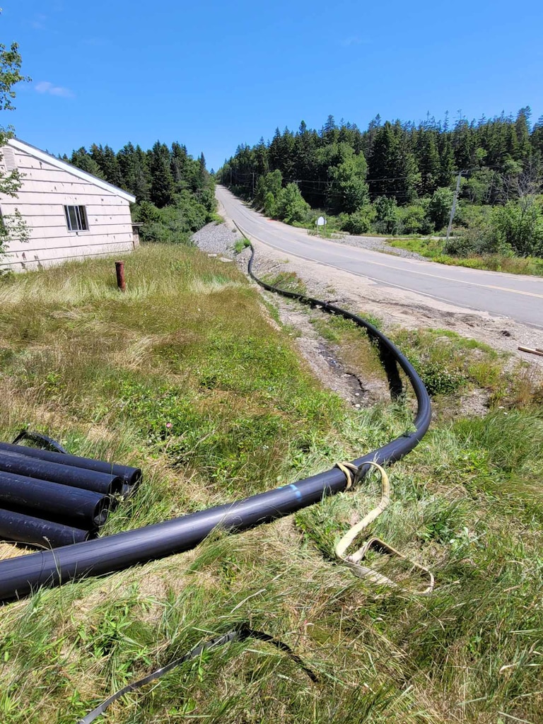 A waterline is installed at Bucks Harbor to bring clean drinking water to residents.