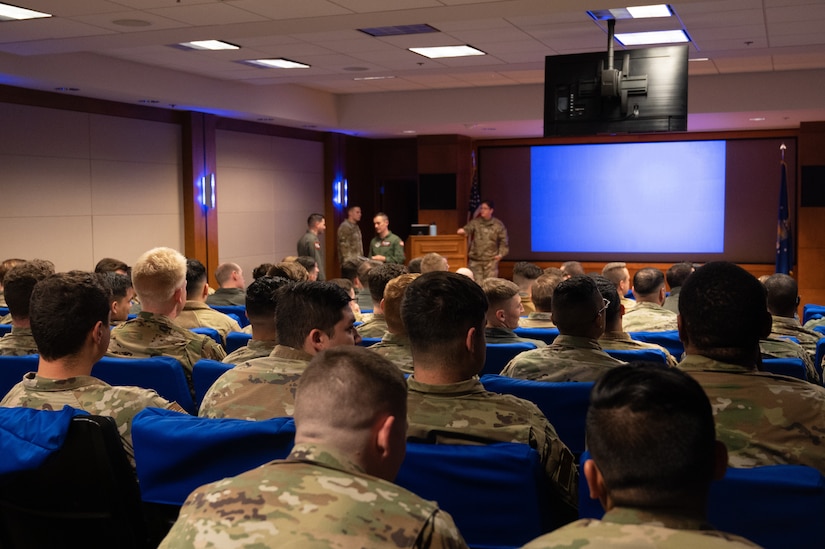 Airmen assigned to Joint Base McGuire-Dix-Lakehurst, N.J., attend an exercise briefing during the Neptune Series at Travis Air Force Base, Calif., Oct. 26, 2023. This joint air interoperability exercise is the first-ever certification event for JB MDL’s KC-46A Pegasus tankers. (U.S. Air Force photo by Airman 1st Class Simonne Barker)