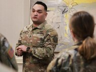 Command Sgt. Maj. Jose Sanchez, the command sergeant major of the 198th Combat Sustainment Support Battalion, talk to the 1744th Transportation Company NCOs after the 1744th Transportation Company's Welcome Home Ceremony.