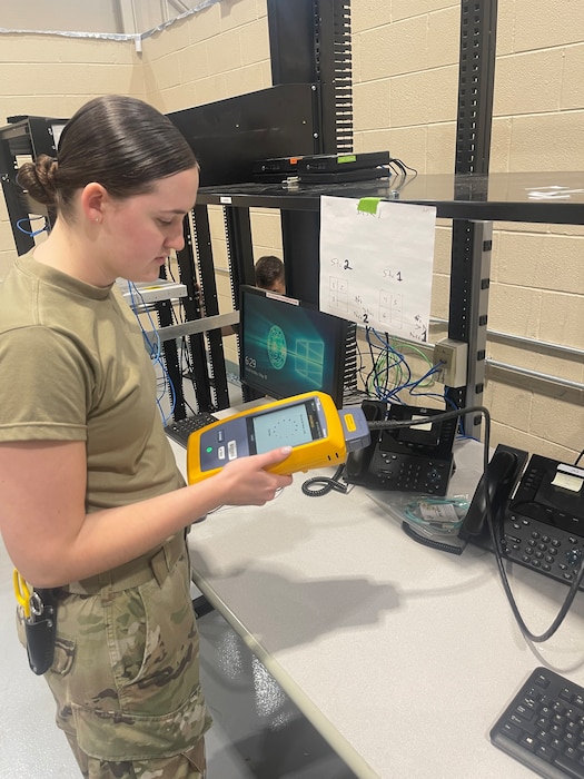 U.S. Air Force Senior Airman Shannon Godwin, 85th Engineering and Installation Squadron Radio Frequency technician prepares for cable testing and installation during a system overhaul for the technical training environment at Keesler Air Force Base