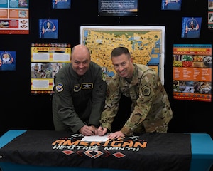 U.S. Air Force Col. Benjamin Jensen, 5th Bomb Wing deputy commander, and U.S. Air Force Col. George L. Chapman, 91st Missile Wing deputy commander, sign a proclamation marking the start of Native American Heritage Month at Minot Air Force Base, North Dakota, Nov. 1, 2023. Native American Heritage Month was signed into law in 1990, and the U.S. Air Force has honored this tradition by paying respects to past and present Native American Airmen. (U.S. Air Force photo by Senior Airman Caleb S. Kimmell)