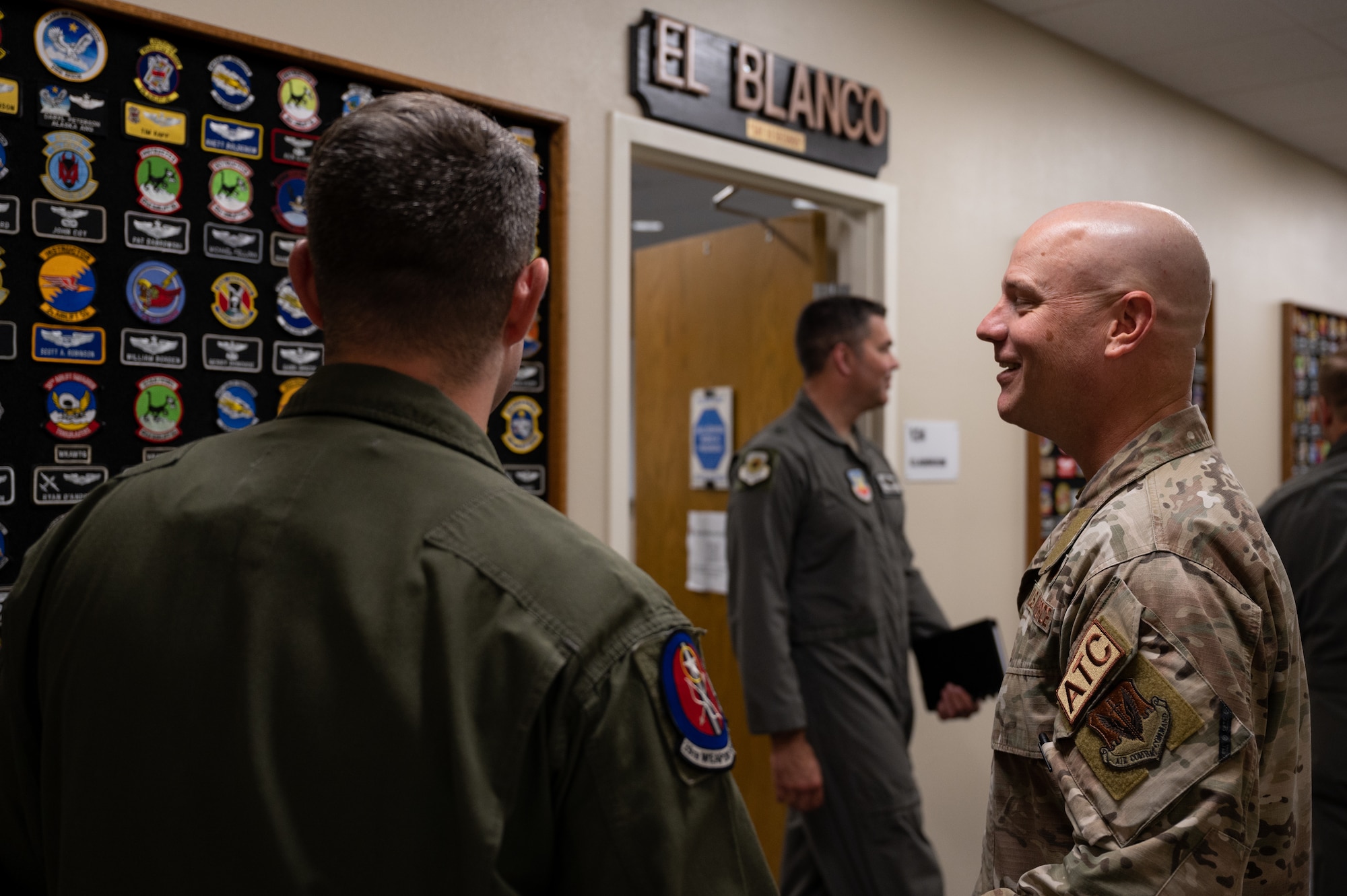 Airmen explaining patch wall significance