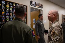 Airmen explaining patch wall significance