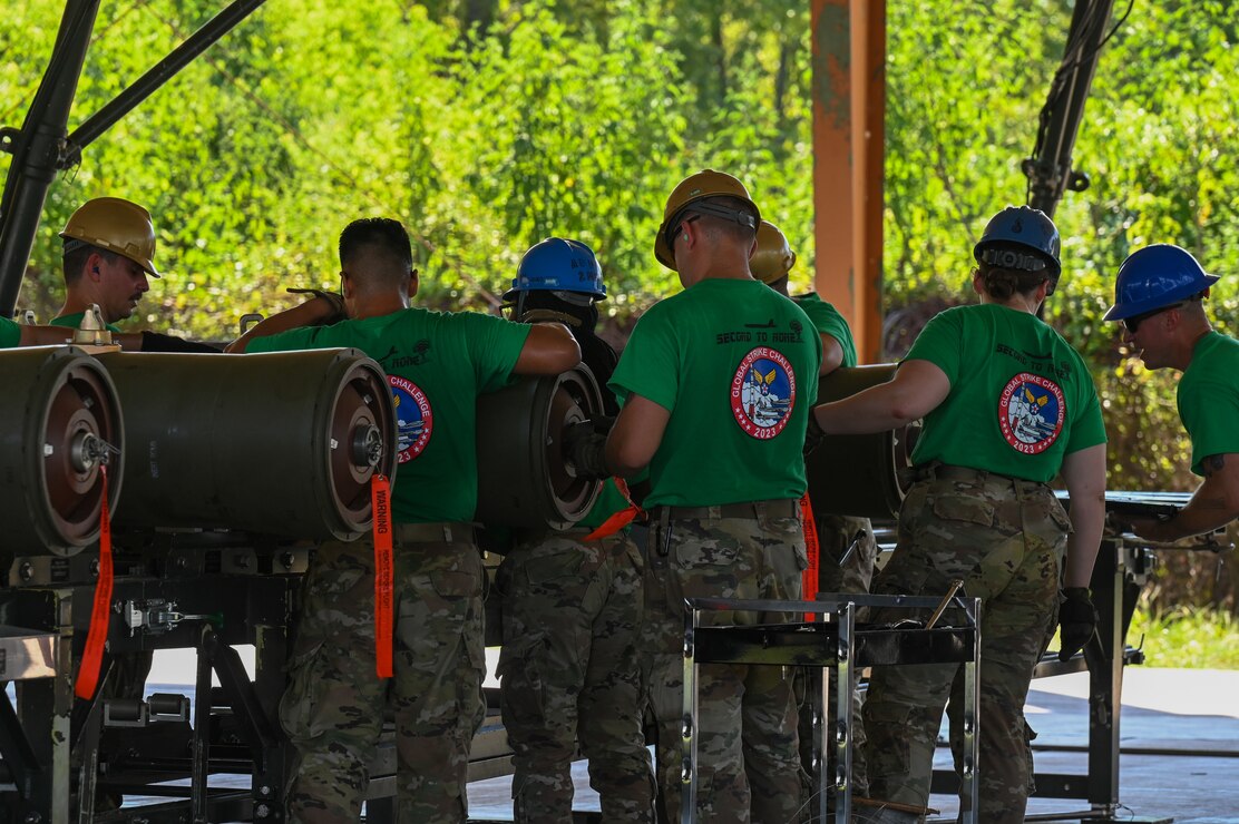 Airmen from the 2nd Munitions Squadron install fuzes into the tails of BLU-109 bomb bodies during the Global Strike Challenge Sep. 7, 2023 at Barksdale Air Force Base, La. Each GSC team was evaluated on their performance in events that require teamwork, efficiency, and innovative thinking.(U.S. Air Force photo by Airman 1st Class Seth Watson)