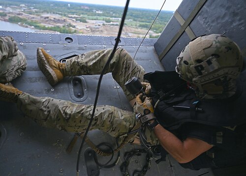 U.S. Air Force Senior Enlisted Advisor to the Chairman Ramón “CZ” Colón-López, checks his hoist during his fini-flight in Louisville, Ky., Sept. 6, 2023. Colón-López was a career pararescueman and was assigned to the 48th Rescue Squadron at Holloman Air Force Base, N.M., before the squadron was relocated to Davis-Monthan Air Force Base, Ariz. (U.S. Air Force photo by Staff Sgt. Abbey Rieves)