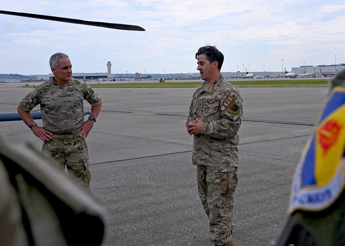 U.S. Air Force Senior Enlisted Advisor to the Chairman Ramón “CZ” Colón-López, left, listens to Senior Master Sgt. Joshua Andrada, 563rd Rescue Group standards and evaluations superintendent, speak in Louisville, Ky., Sept. 6, 2023. Colón-López was a pararescue instructor when Andrada went through technical training 20 years ago. (U.S. Air Force photo by Staff Sgt. Abbey Rieves)