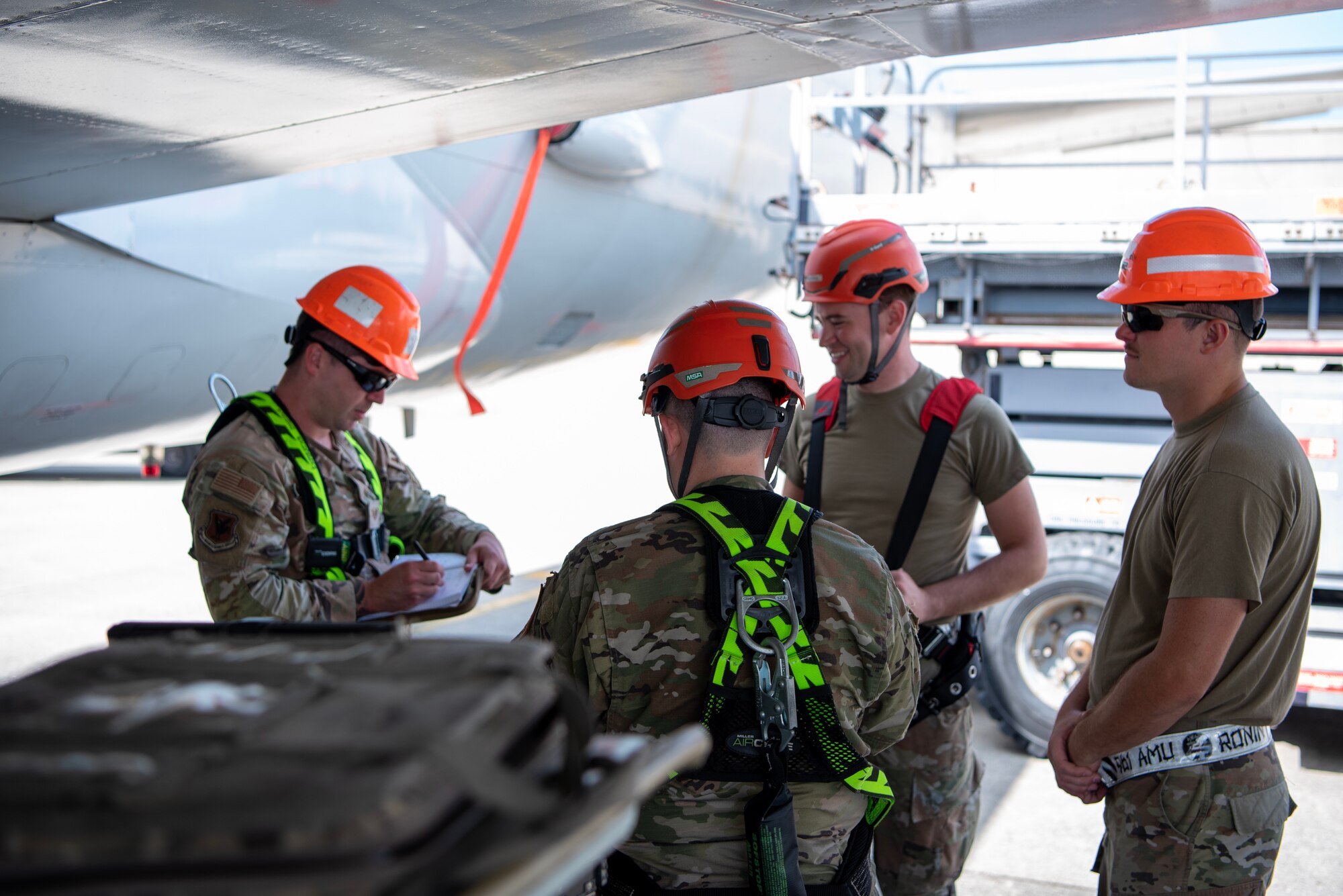 961st Aircraft Maintenance Unit consult each other before beginning work