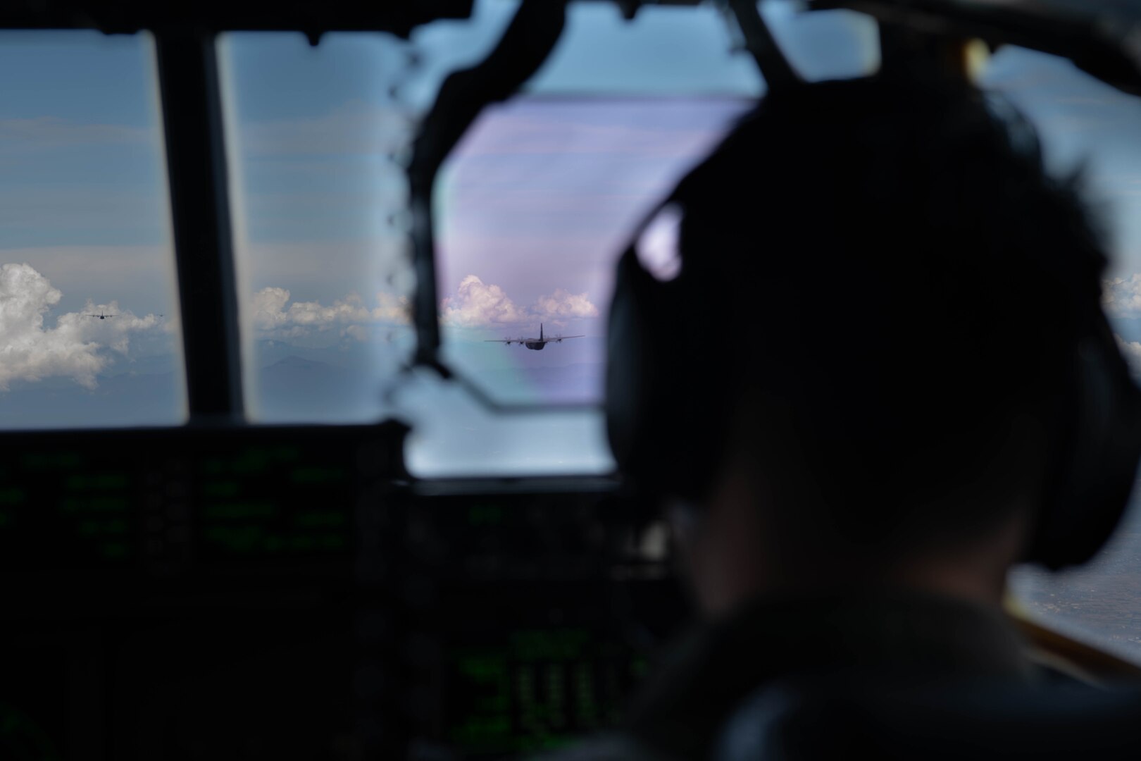 C-130J Super Hercules assigned to the 36th Airlift Squadron fly over the Japanese coastline after completing airdrops during Exercise Beverly Morning at Yokota Air Base, Japan, Oct. 25, 2023. The 36th AS maintains C-130J mission-ready aircrew to conduct theater airlift, special operations, aeromedical evacuation, search and rescue, repatriation and humanitarian relief missions. (U.S. Air Force Photo by Senior Airman Brooklyn Golightly)